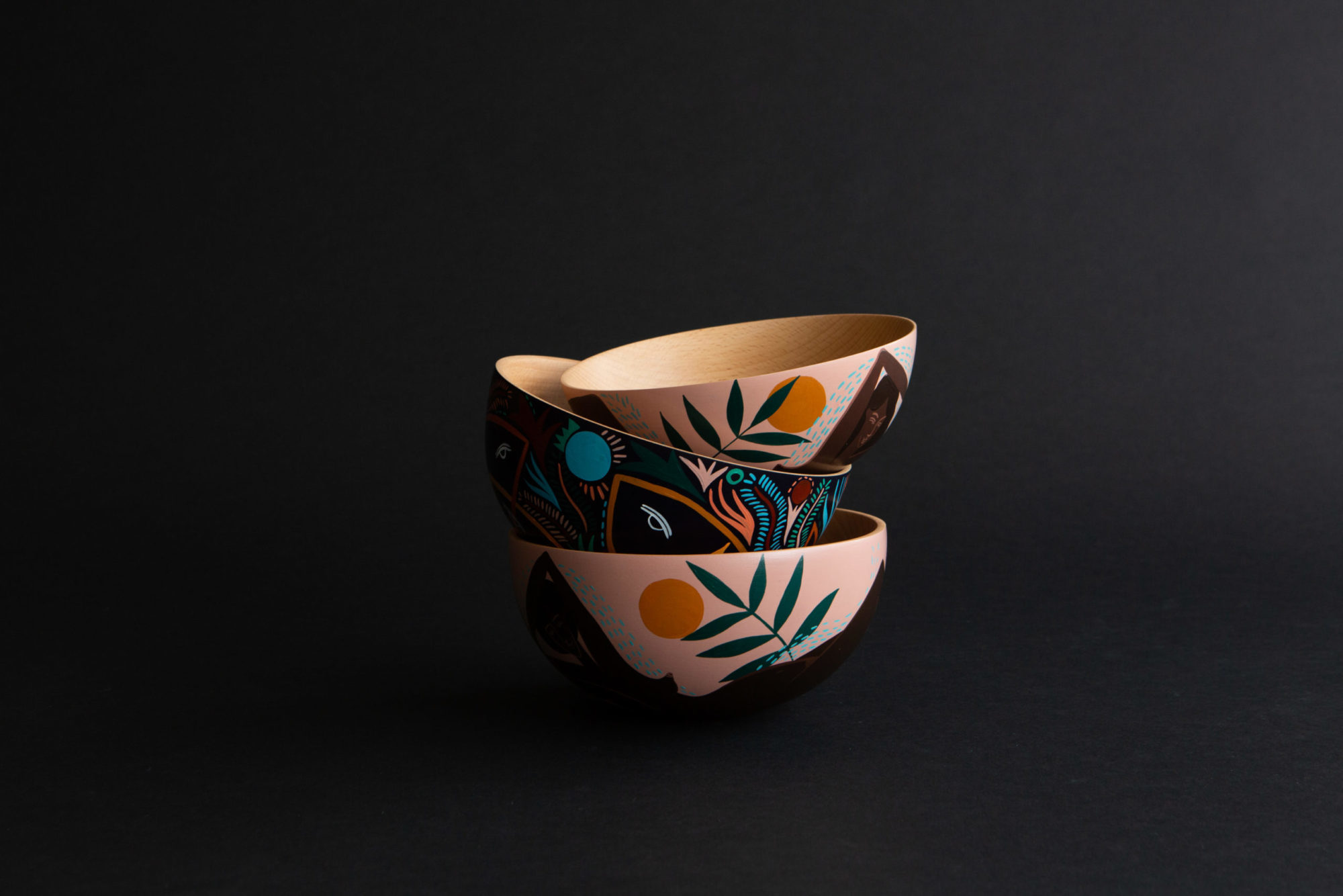 painted bowls on a dark background