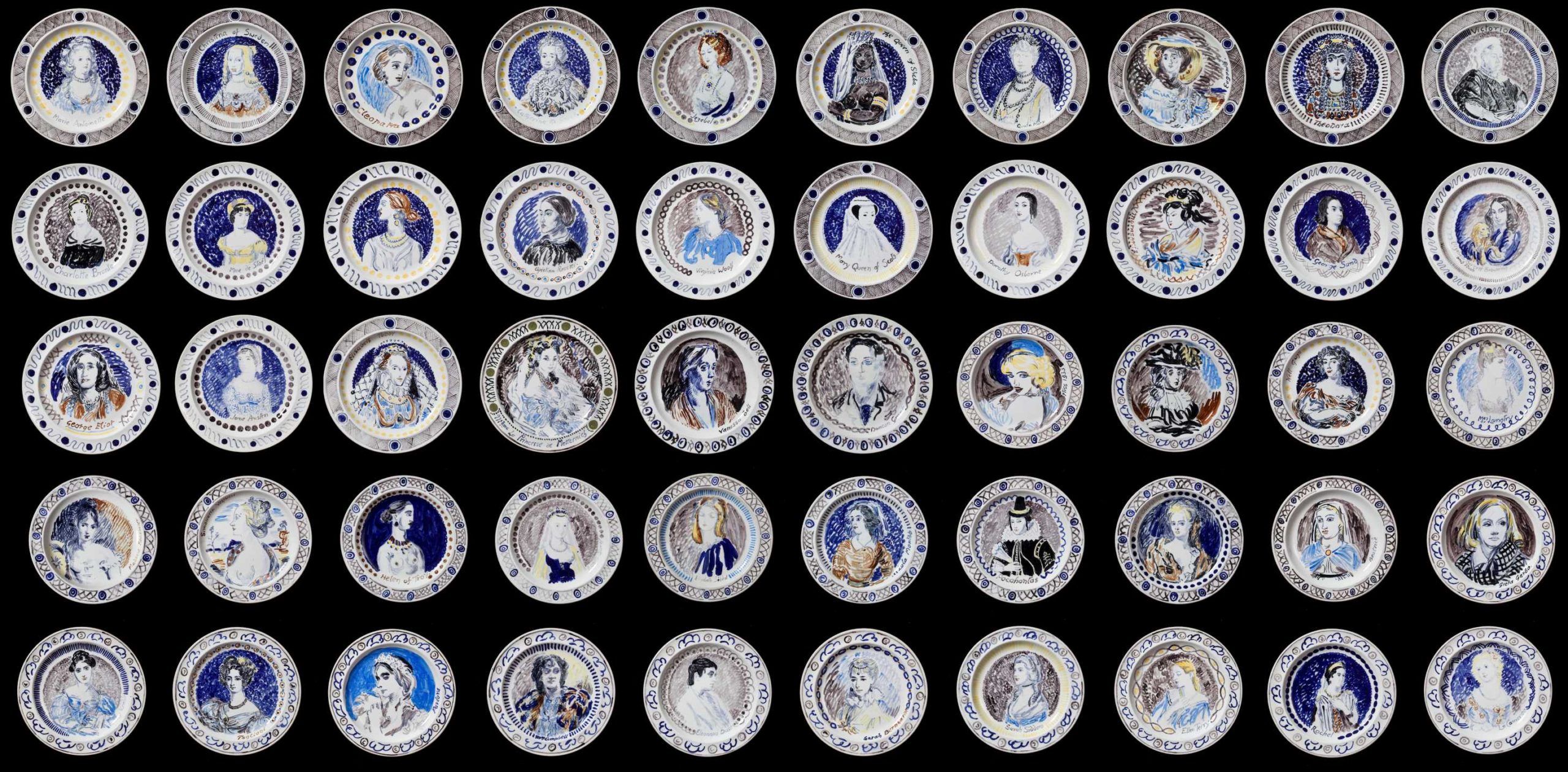 All 50 plates of the Famous Women Dinner Service lined up in rows. Portraits of different women are on each plate painted in shades of white and blue.